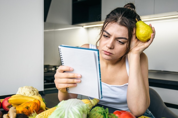 Woman frustrated with diet tracking notebook